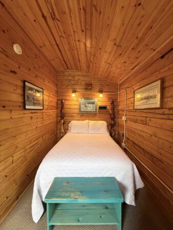 Single bed in a Standard One-Room Cabin at EarthSong Lodge & Cabins
