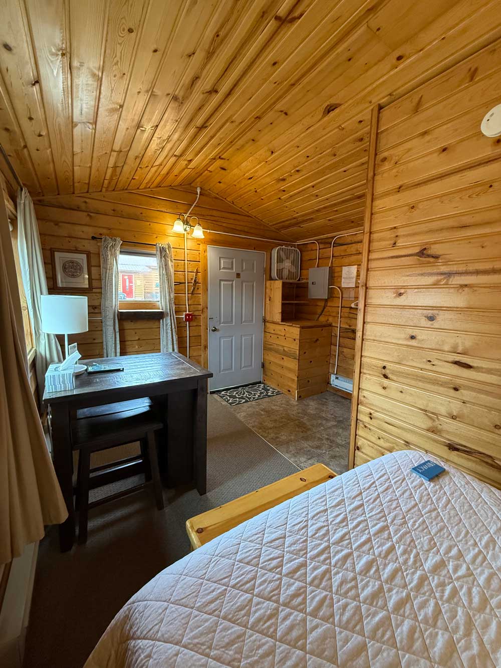 Bedroom area of a Standard One-Room Cabin at EarthSong Lodge & Cabins