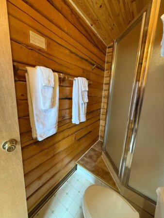 Bath towels and amenities in a Standard One-Room Cabin at EarthSong Lodge & Cabins